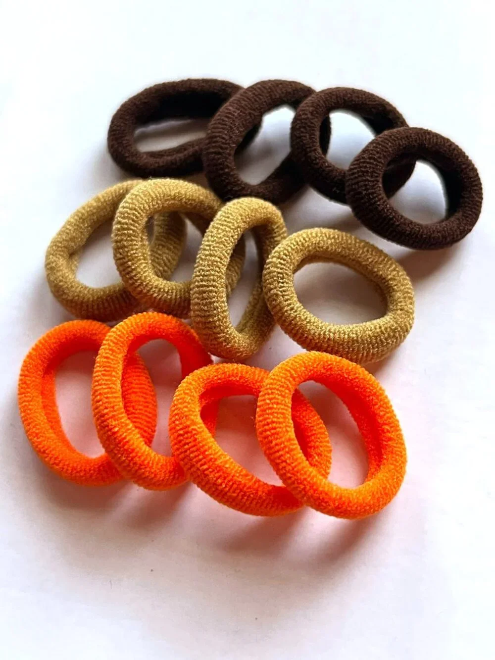 Brown and orange hair elastics NWOT *free in bundle*